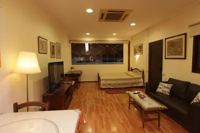 a living room with a couch and a table at Nicosia Luxury Studio in Nicosia