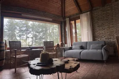 a living room with a couch and a table at Kardama HideAway in Kato Amiandos