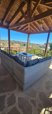 a large wicker couch sitting on a patio at Villa Elizabeth in Limassol