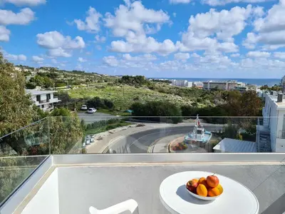 a bowl of fruit on a table on a balcony at Napa City Apartments in Ayia Napa