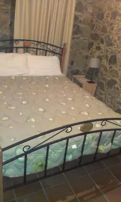 a bedroom with a bed in a room at Patriko Traditional House in Kakopetria