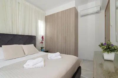 a bedroom with a bed with two towels on it at Villa Serena in Protaras