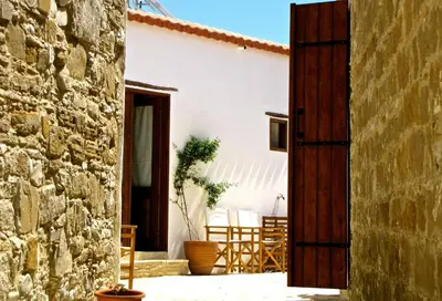 an entrance to a house with a wooden door at Saint Antonio Maroni in Maroni