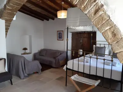 a living room with a bed and a couch at Saint Antonio Maroni in Maroni