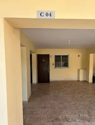 an empty lobby of a building with a door at Nissi 3 C4 Pool View Apt in Ayia Napa
