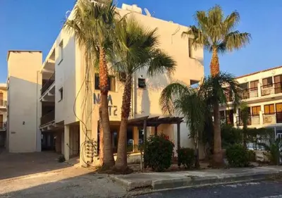 a building with palm trees in front of it at Napa Court 2 in Ayia Napa