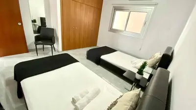 a small room with a bed and a chair at Napa Court 2 in Ayia Napa