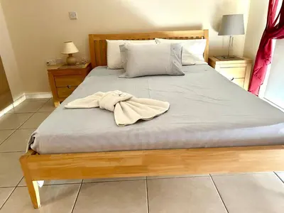 a bedroom with a bed with a towel on it at Nissi Elena A11 in Ayia Napa