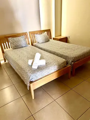 two beds sitting next to each other in a room at Nissi Elena A11 in Ayia Napa