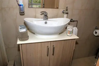 a bathroom with a white sink on top of a cabinet at Villa Anastasia in Ayia Napa