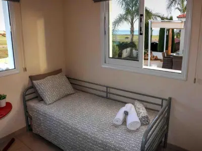 a bedroom with a bed with towels on it at Villa Anastasia in Ayia Napa