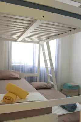 a bedroom with a bunk bed with a ladder at Villa St. Nicolas 8 - Protaras in Protaras