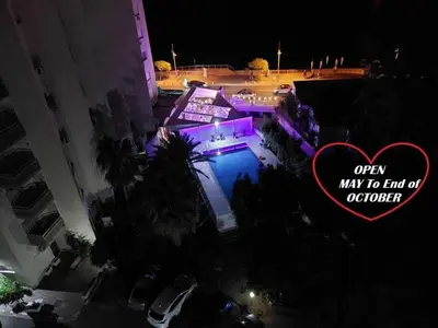 an open may to find a mansion at night at Front-Row - Skyline Retreat - Pool Access in Larnaka