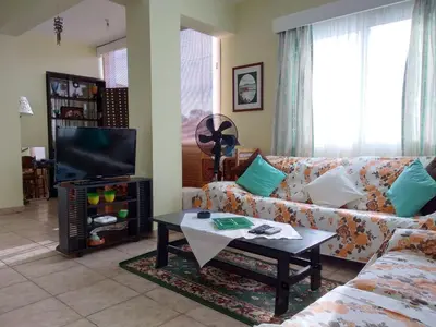 a living room with a couch and a coffee table at Spacious 1 Bedroom Apartment in Kapparis Area in Paralimni