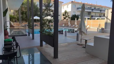 a view of a swimming pool from a building at Cosy apartment in a luxury resort in Paralimni