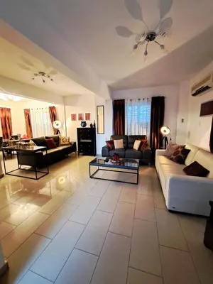 a large living room with a couch and a table at Anasta villa in Protaras