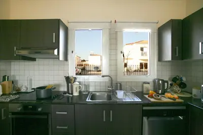 a kitchen with a sink and a window at Villa Carmel in Ayia Napa