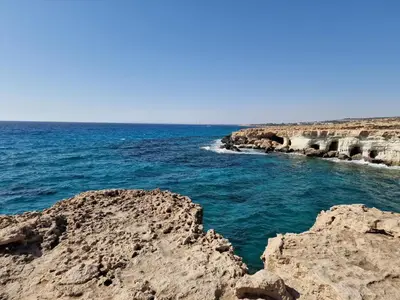 a view of the ocean from a rocky beach at Oceania Bay Village in Pyla