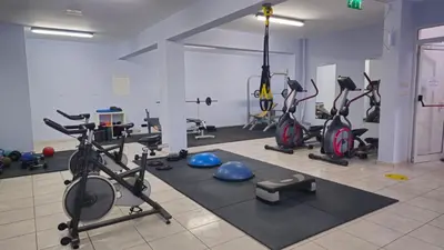 a gym with several exercise bikes and exercise balls at Oceania Bay Village in Pyla