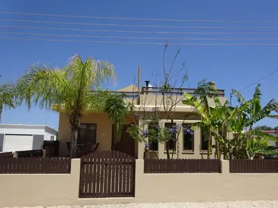 a house with a fence in front of it at Rustic House in Xylophaghou