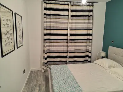 a small bedroom with a bed and a window at Yippee!(Perfect Location) in Larnaka