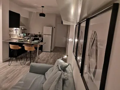 a living room and kitchen with a couch and a table at Yippee!(Perfect Location) in Larnaka