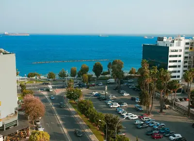 an aerial view of a parking lot next to the ocean at Poseidon Boutique Apartment 2 in Limassol