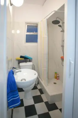 a bathroom with a sink and a toilet and a shower at Poseidon Boutique Apartment 2 in Limassol