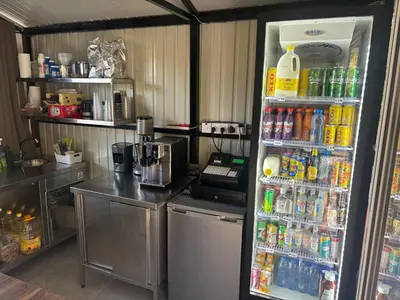 a refrigerator filled with lots of drinks in a kitchen at SOFROS VALLEY HILLS CHALET in Ayios Mamas