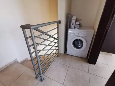 a laundry room with a washing machine and a washer at BG04 Mythical Sands in Paralimni