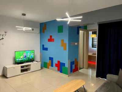a living room with a large pixelated wall at Fat Cow Apartment 103 in Larnaka