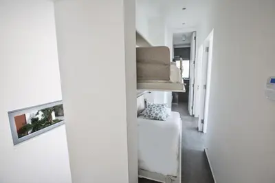 a hallway with a bed and a couch at Villa Chana in Protaras