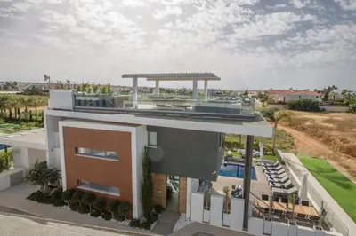 an aerial view of a building with a swimming pool at Villa Chana in Protaras