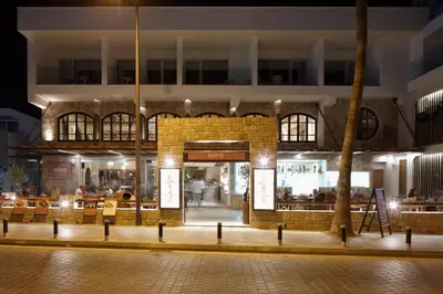 a store front of a building at night at Melpo Antia Hotel & Suites in Ayia Napa