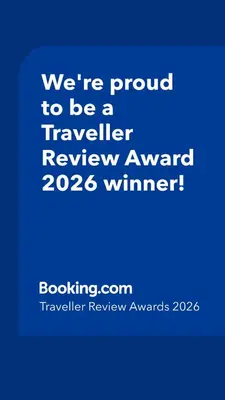 a blue sign that says were proud to be a traveller reviewagency winner at Salt Lake Town House in Larnaka