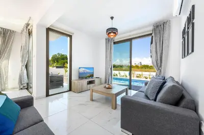 a living room with a couch and a table at Levanda #40 in Protaras