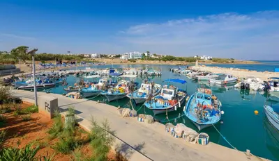 a bunch of boats are docked in a harbor at Levanda #40 in Protaras