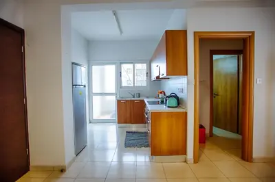 a kitchen with a sink and a counter top at Yippee! Apartments I Town Center in Larnaka