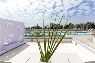 a plant in a vase on top of a building at NAPA GEM SUITES by LUXEL VILLAS in Ayia Napa