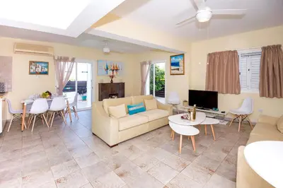 a living room with a couch and a table at Villa Aleta in Protaras