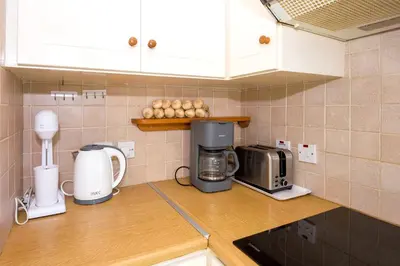 a kitchen counter with a coffee maker and a toaster at Villa Aleta in Protaras