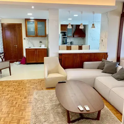a living room with a couch and a table at Modern 2 bed room large apartment in Nicosia