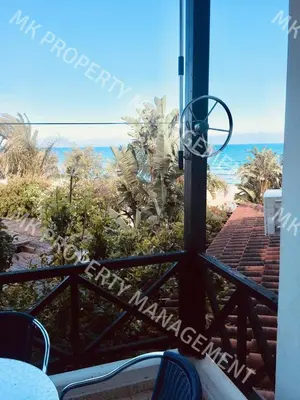 a view of the ocean from the balcony of a house at Yiallos Village C107 in Larnaka