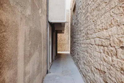an alley in an alley way between two buildings at eins rooms - city center in Limassol