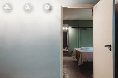 a door leading to a bedroom with a bed at eins rooms - city center in Limassol