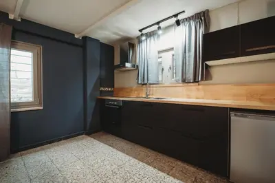 a kitchen with a sink and a window at eins rooms - city center in Limassol