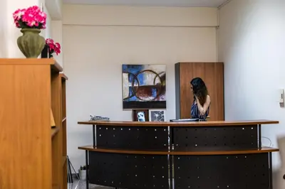 a woman statue sitting on top of a counter in a room at Elysium Capital Residence in Nicosia