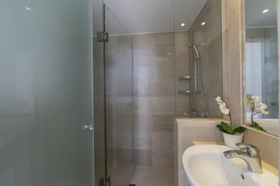 a bathroom with a shower and a sink at Protaras Villa Kalena Seafront in Protaras