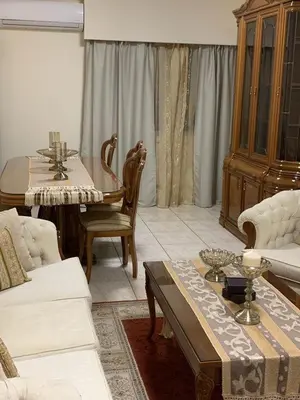 a living room with a couch and a table at Tony’s Boutique Apartment in Larnaka