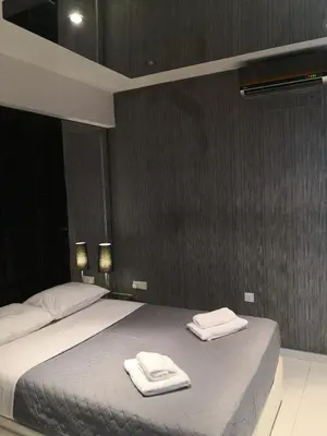 a bedroom with a bed with two towels on it at Fine Designed Flat 302 in Larnaka
